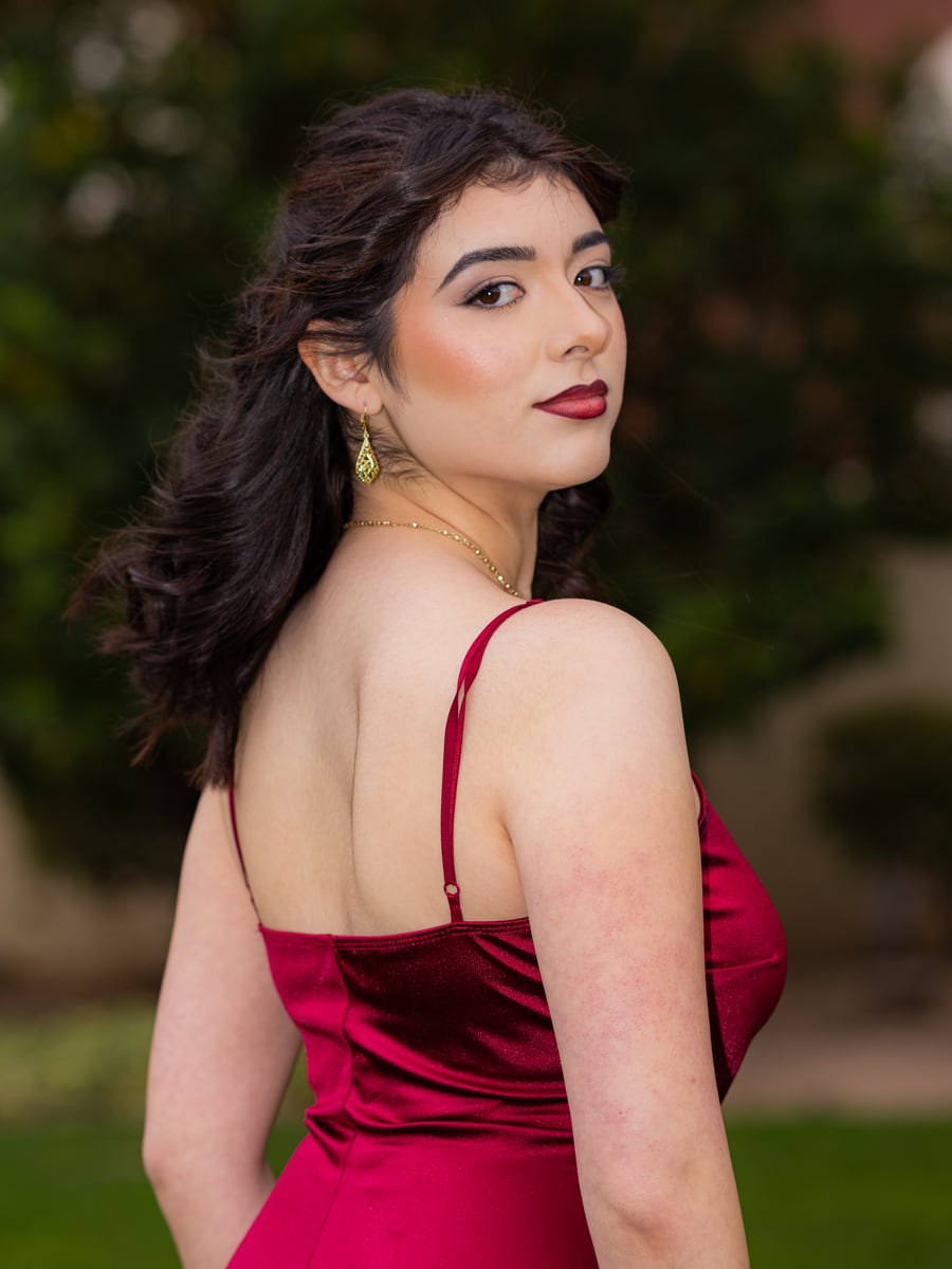 Editorial portrait of a woman in a red dress