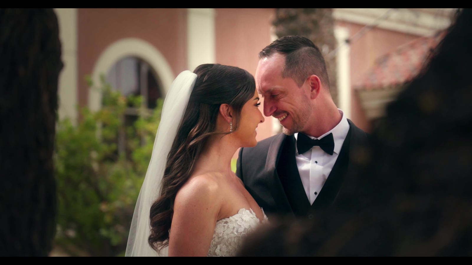 Bride and groom sharing a quiet moment outdoors